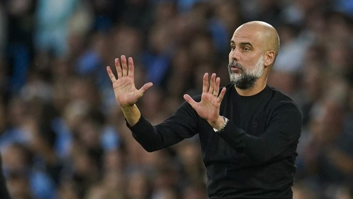 Manchester Citys head coach Pep Guardiola gives instructions to his players during the English Premier League soccer match between Manchester City and Newcastle at the Etihad stadium in Manchester, England, Saturday, Aug. 19, 2023. (AP Photo/Dave Thompson)