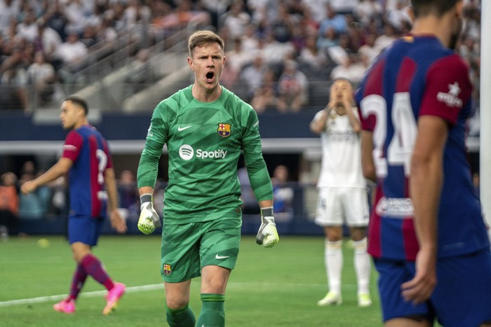 FC Barcelona goalkeeper Marc-Andre ter Stegen celebrates a defensive stop during the second half of a Champions Tour soccer match against Real Madrid, Saturday, July 29, 2023 at AT&T Stadium in Arlington, Texas. FC Barcelona won 3-0. (AP Photo/Jeffrey McWhorter)