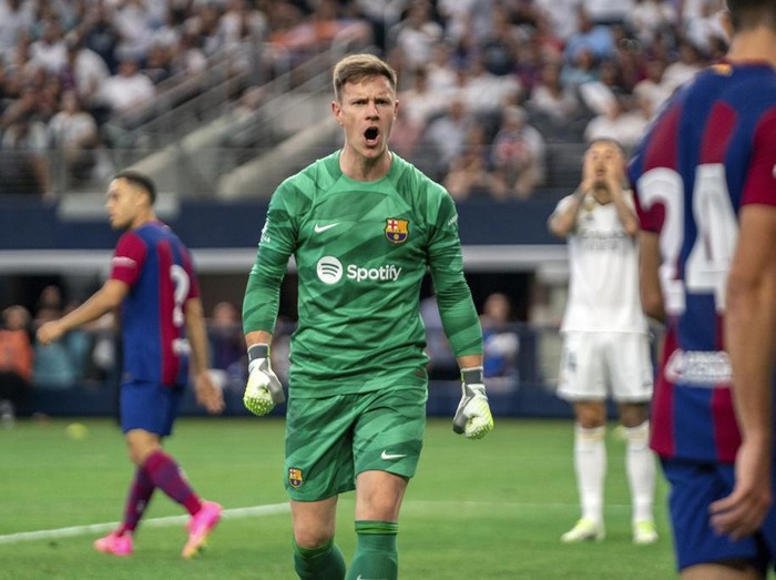 FC Barcelona goalkeeper Marc-Andre ter Stegen celebrates a defensive stop during the second half of a Champions Tour soccer match against Real Madrid, Saturday, July 29, 2023 at AT&T Stadium in Arlington, Texas. FC Barcelona won 3-0. (AP Photo/Jeffrey McWhorter)
