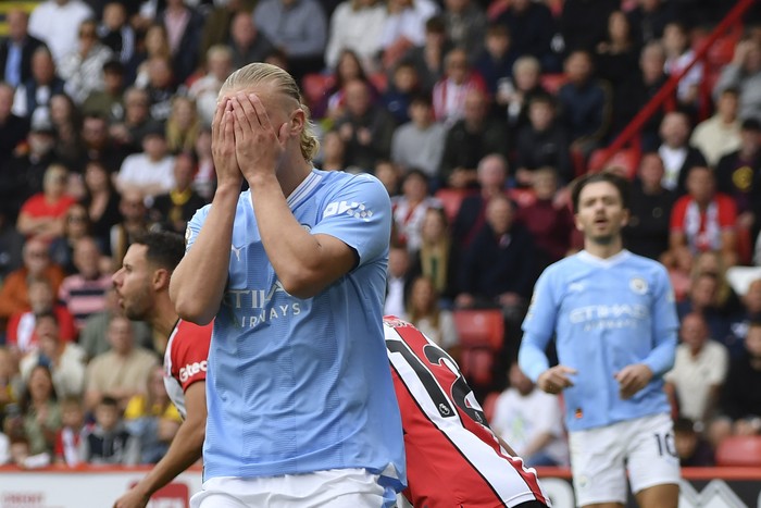 Manchester Citys Erling Haaland reacts after missing a scoring chance during the English Premier League soccer match between Sheffield United and Manchester City at Bramall Lane in Sheffield, England, Sunday, Aug. 27, 2023. (AP Photo/Rui Vieira)