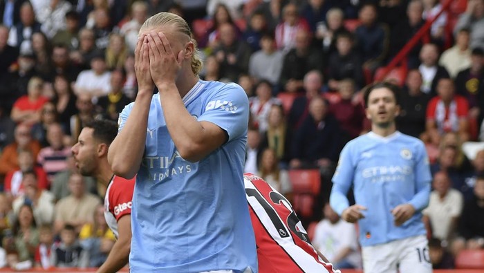 Manchester Citys Erling Haaland reacts after missing a scoring chance during the English Premier League soccer match between Sheffield United and Manchester City at Bramall Lane in Sheffield, England, Sunday, Aug. 27, 2023. (AP Photo/Rui Vieira)