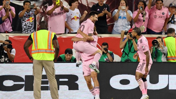 Aug 26, 2023; Harrison, New Jersey, USA; Inter Miami CF forward Lionel Messi (10) celebrates after scoring a goal against the New York Red Bulls with midfielder Benjamin Cremaschi (30) and defender DeAndre Yedlin (2) during the second half at Red Bull Arena. Mandatory Credit: Vincent Carchietta-USA TODAY Sports