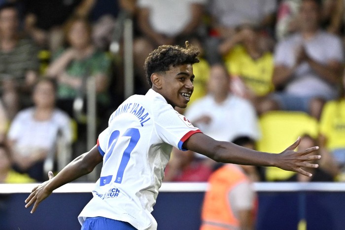 Barcelonas Spanish forward #27 Lamine Yamal celebrates after Barcelonas Polish forward #09 Robert Lewandowski (not seen) scored during the Spanish Liga football match between Villarreal CF and FC Barcelona at La Ceramica stadium in Vila-real on August 27, 2023. (Photo by JAVIER SORIANO / AFP)