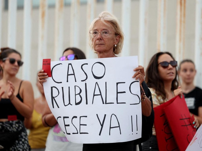 Soccer Football - People protest outside the Spanish Soccer Federation - Ciudad Del Futbol Las Rozas, Las Rozas, Spain - August 25, 2023  People hold banners as they protest against President of the Royal Spanish Football Federation Luis Rubiales REUTERS/Isabel Infantes