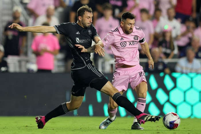 Aug 30, 2023; Fort Lauderdale, Florida, USA; Inter Miami forward Lionel Messi (10) kicks the ball past Nashville SC defender Jack Maher (5) during the second half at DRV PNK Stadium. Mandatory Credit: Sam Navarro-USA TODAY Sports