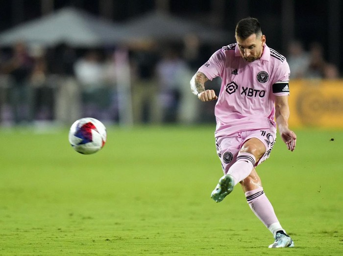 Aug 30, 2023; Fort Lauderdale, Florida, USA; Inter Miami forward Lionel Messi (10) shoots the ball against Nashville SC  during the first half at DRV PNK Stadium. Mandatory Credit: Rich Storry-USA TODAY Sports