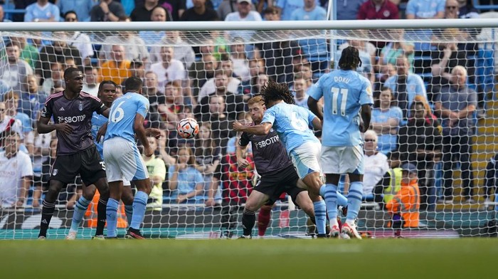 Manchester Citys Nathan Ake scores his sides second goal during the English Premier League soccer match between Manchester City and Fulham at the Etihad stadium in Manchester, England, Saturday, Sept. 2, 2023. (AP Photo/Dave Thompson)