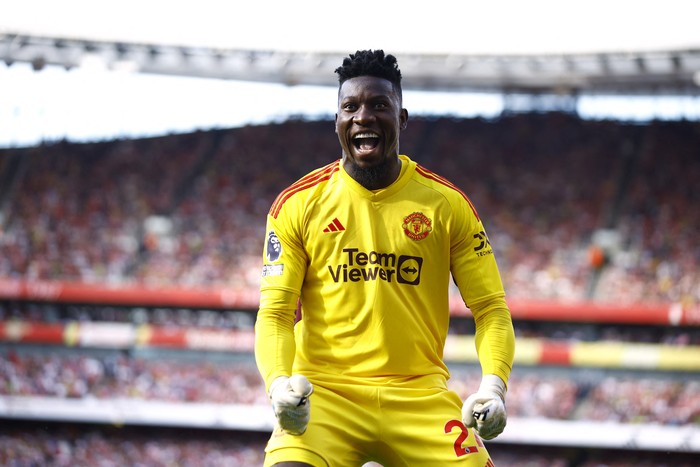 Soccer Football - Premier League - Arsenal v Manchester United - Emirates Stadium, London, Britain - September 3, 2023  Manchester Uniteds Andre Onana celebrates after Marcus Rashford scores their first goal Action Images via Reuters/John Sibley EDITORIAL USE ONLY. No use with unauthorized audio, video, data, fixture lists, club/league logos or live services. Online in-match use limited to 75 images, no video emulation. No use in betting, games or single club /league/player publications.  Please contact your account representative for further details.