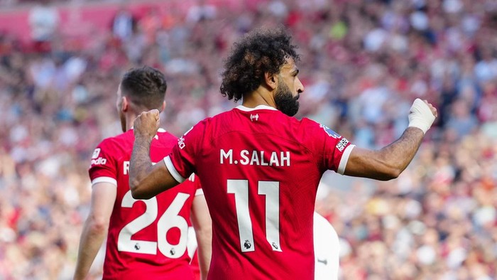 Liverpool's Mohamed Salah celebrates after scoring his side's third goal during the English Premier League soccer match between Liverpool and Aston Villa at Anfield stadium in Liverpool, Sunday, Sept. 3, 2023. (AP Photo/Jon Super)