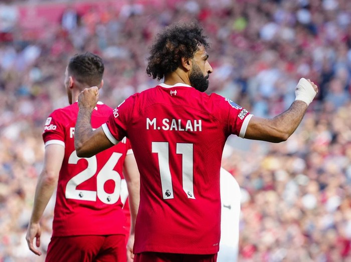 Liverpool's Mohamed Salah celebrates after scoring his side's third goal during the English Premier League soccer match between Liverpool and Aston Villa at Anfield stadium in Liverpool, Sunday, Sept. 3, 2023. (AP Photo/Jon Super)