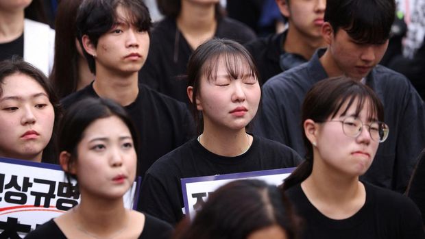 South Korean teachers take part in a protest to demand better protection of their rights, the normalization of public education and to mourn a young teacher found dead in July in an apparent suicide, in Seoul, South Korea, September 4, 2023. The signs read 