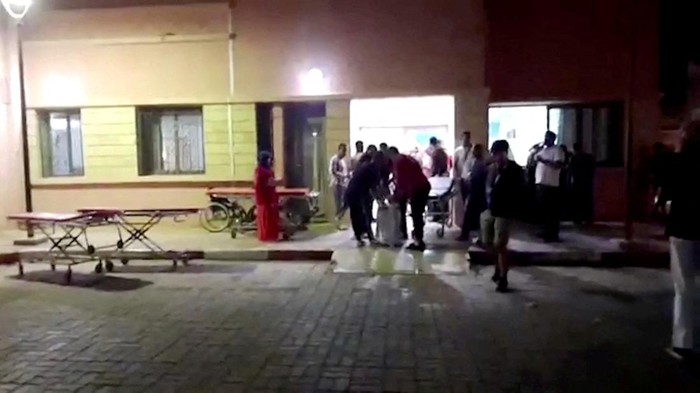 People gather outside Sidi Hsain Hospital, following a powerful quake, in Ouarzazate, Morocco, September 9, 2023 in this screen grab obtained from a handout video. Radio Sawt Ouarzazate/via Reuters TV/Handout via REUTERSTHIS IMAGE HAS BEEN SUPPLIED BY A THIRD PARTY. NO RESALES. NO ARCHIVES. MANDATORY CREDIT