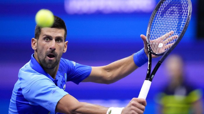 Novak Djokovic, of Serbia, holds up the championship trophy after defeating Daniil Medvedev, of Russia, in the mens singles final of the U.S. Open tennis championships, Sunday, Sept. 10, 2023, in New York. (AP Photo/Manu Fernandez)