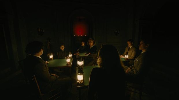 (Facing front, L-R): Jude Hill as Leopold Ferrier, Camille Cottin as Olga Seminoff, Michelle Yeoh as Mrs. Reynolds, Jamie Dornan as Dr. Leslie Ferrier, and Kyle Allen as Maxime Gerard in 20th Century Studios' A HAUNTING IN VENICE. Photo courtesy of 20th Century Studios. © 2023 20th Century Studios. All Rights Reserved.