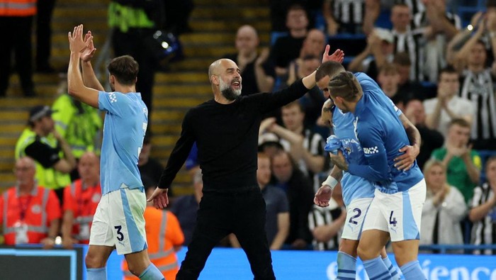 Soccer Football - Premier League - Manchester City v Newcastle United - Etihad Stadium, Manchester, Britain - August 19, 2023 Manchester City manager Pep Guardiola celebrates after the match REUTERS/Phil Noble EDITORIAL USE ONLY. No use with unauthorized audio, video, data, fixture lists, club/league logos or live services. Online in-match use limited to 75 images, no video emulation. No use in betting, games or single club /league/player publications.  Please contact your account representative for further details.