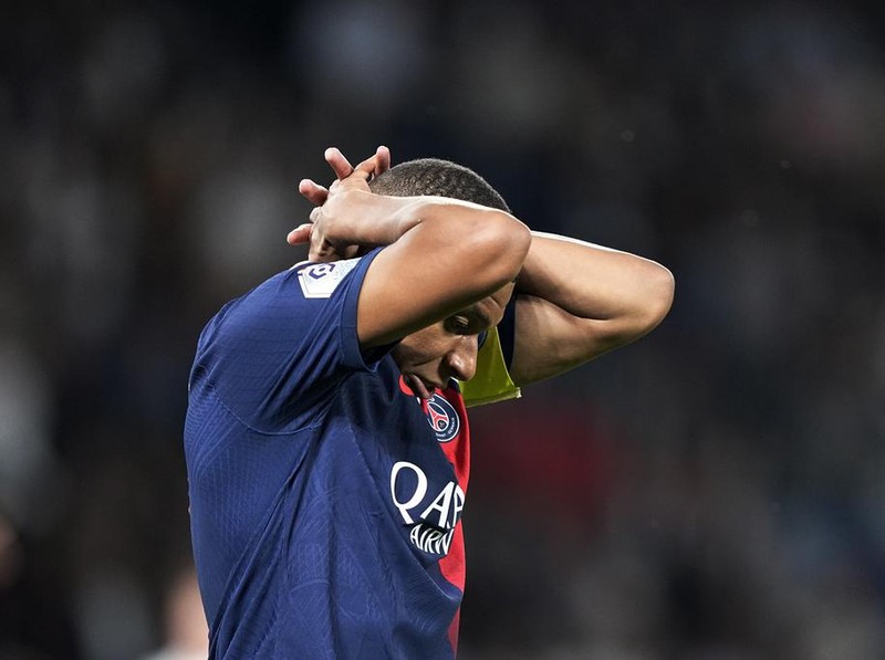 PSG's Kylian Mbappe reacts after missing a scoring chance during the French League One soccer match between Paris Saint Germain and Nice at Parc des Princes stadium in Paris, Friday, Sept. 15, 2023. (AP Photo/Michel Euler)