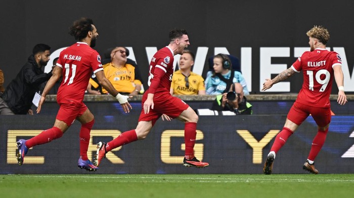 Soccer Football - Premier League - Wolverhampton Wanderers v Liverpool - Molineux Stadium, Wolverhampton, Britain - September 16, 2023 Liverpools Andrew Robertson celebrates scoring their second goal with Mohamed Salah and Harvey Elliott REUTERS/Dylan Martinez NO USE WITH UNAUTHORIZED AUDIO, VIDEO, DATA, FIXTURE LISTS, CLUB/LEAGUE LOGOS OR LIVE SERVICES. ONLINE IN-MATCH USE LIMITED TO 45 IMAGES, NO VIDEO EMULATION. NO USE IN BETTING, GAMES OR SINGLE CLUB/LEAGUE/PLAYER PUBLICATIONS.