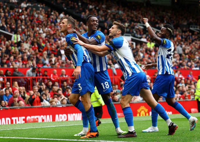 Soccer Football - Premier League - Manchester United v Brighton & Hove Albion - Old Trafford, Manchester, Britain - September 16, 2023 Brighton & Hove Albions Pascal Gross celebrates scoring their second goal with Danny Welbeck and Adam Lallana REUTERS/Molly Darlington NO USE WITH UNAUTHORIZED AUDIO, VIDEO, DATA, FIXTURE LISTS, CLUB/LEAGUE LOGOS OR LIVE SERVICES. ONLINE IN-MATCH USE LIMITED TO 45 IMAGES, NO VIDEO EMULATION. NO USE IN BETTING, GAMES OR SINGLE CLUB/LEAGUE/PLAYER PUBLICATIONS.     TPX IMAGES OF THE DAY