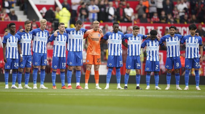 Brighton players observe a minute of silence in memory of the victims of the natural disasters in Morocco and Libya before the English Premier League soccer match between Manchester United and Brighton and Hove Albion at Old Trafford stadium in Manchester, England, Saturday, Sept. 16, 2023. (AP Photo/Dave Thompson)