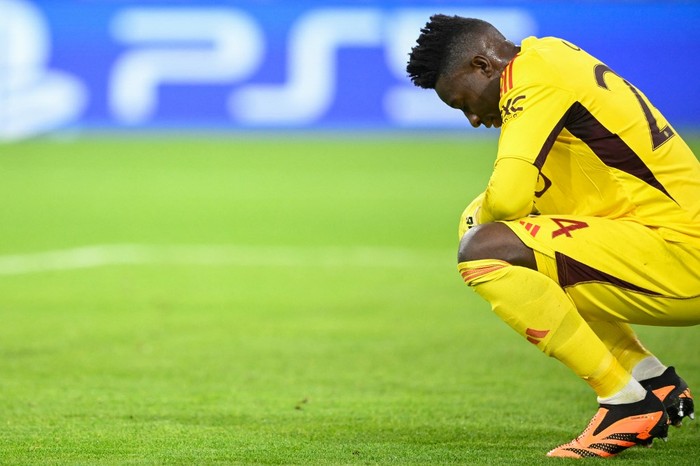 Manchester Uniteds Cameroonian goalkeeper #24 Andre Onana reacts after conceding the opening goal during the UEFA Champions League Group A football match FC Bayern Munich v Manchester United in Munich, southern Germany on September 20, 2023. (Photo by Tobias SCHWARZ / AFP)