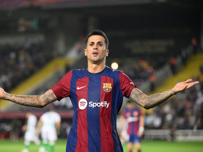 Barcelona's Portuguese defender #02 Joao Cancelo celebrates after scoring his team's fifth goal during the Spanish Liga football match between FC Barcelona and Real Betis at the Estadi Olimpic Lluis Companys in Barcelona on September 16, 2023. (Photo by Josep LAGO / AFP)
