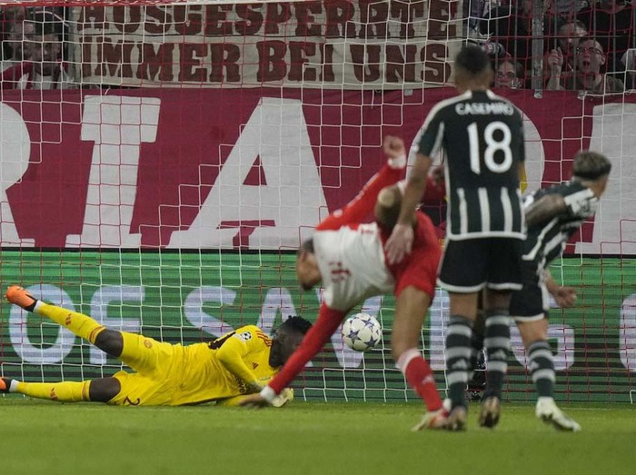 Bayern's Leroy Sane, centre, celebrates after scoring his side's opening goal during the Champions League group A soccer match between Bayern Munich and Manchester United at the Allianz Arena stadium in Munich, Germany, Wednesday, Sept. 20, 2023. (AP Photo/Matthias Schrader)