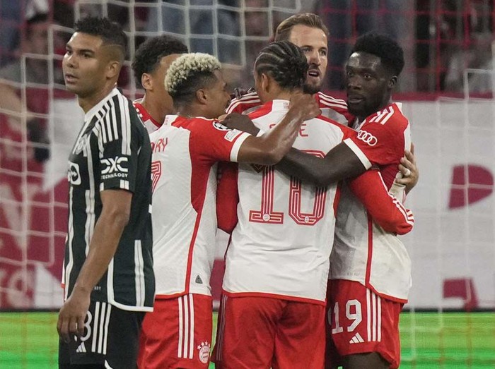 Bayern's Leroy Sane, centre, celebrates after scoring his side's opening goal during the Champions League group A soccer match between Bayern Munich and Manchester United at the Allianz Arena stadium in Munich, Germany, Wednesday, Sept. 20, 2023. (AP Photo/Matthias Schrader)