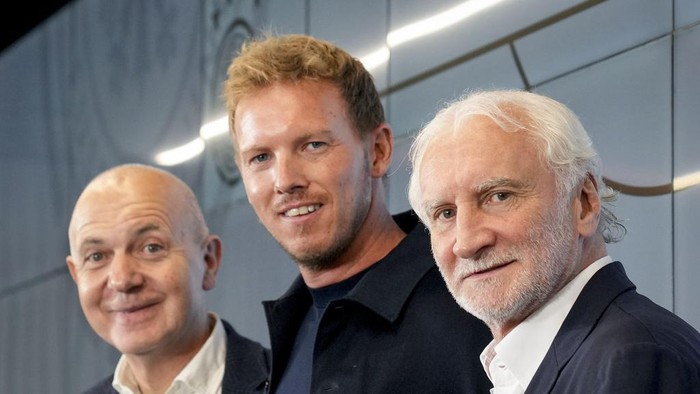 New coach of German national soccer team Julian Nagelsmann, centre, President of German football federation Bernd Neuendorf, left, and sports director Rudi Moeller stand together at a press conference in Frankfurt, Germany, Friday, Sept. 22, 2023. (AP Photo/Michael Probst)