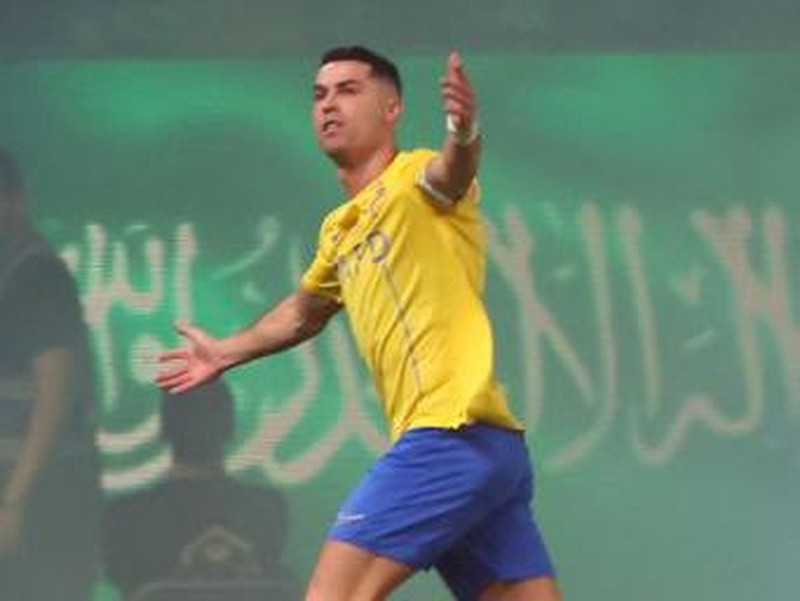 Nassr's Portuguese forward #07 Cristiano Ronaldo celebrates scoring during the Saudi Pro League football match between Al-Nassr and Al-Ahli at the King Saud University Stadium in Riyadh, on September 22, 2023. (Photo by Fayez NURELDINE / AFP)