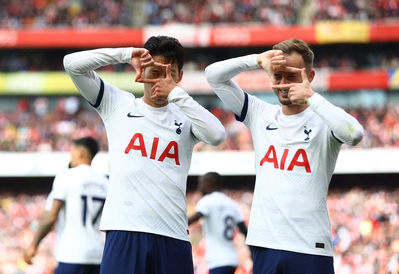 Tottenham Hotspur Soccer Football - Premier League - Arsenal v Tottenham Hotspur - Emirates Stadium, London, Britain - September 24, 2023 Tottenham Hotspur's Son Heung-min celebrates scoring their second goal with James Maddison Action Images via Reuters/Matthew Childs NO USE WITH UNAUTHORIZED AUDIO, VIDEO, DATA, FIXTURE LISTS, CLUB/LEAGUE LOGOS OR 'LIVE' SERVICES. ONLINE IN-MATCH USE LIMITED TO 45 IMAGES, NO VIDEO EMULATION. NO USE IN BETTING, GAMES OR SINGLE CLUB/LEAGUE/PLAYER PUBLICATIONS.