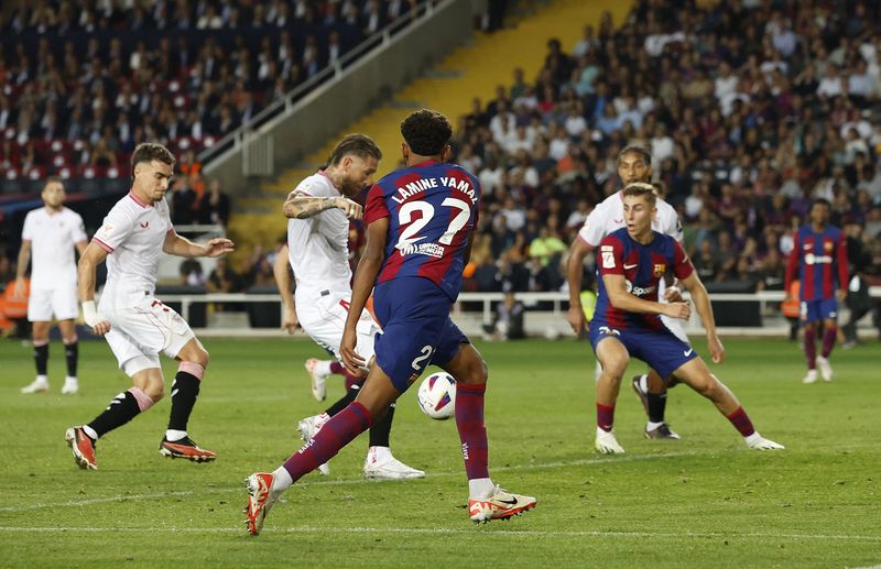 Soccer Football - LaLiga - FC Barcelona v Sevilla - Estadi Olimpic Lluis Companys, Barcelona, Spain - September 29, 2023 Sevilla's Sergio Ramos scores an own goal and FC Barcelona's first REUTERS/Albert Gea