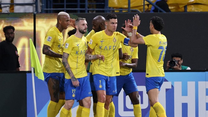 Soccer Football - Asian Champions League - Group E - Al-Nassr v FC Istiklol - Al-Awwal Park, Riyadh, Saudi Arabia - October 2, 2023 Al Nassrs Cristiano Ronaldo celebrates scoring their first goal with teammates REUTERS/Ahmed Yosri