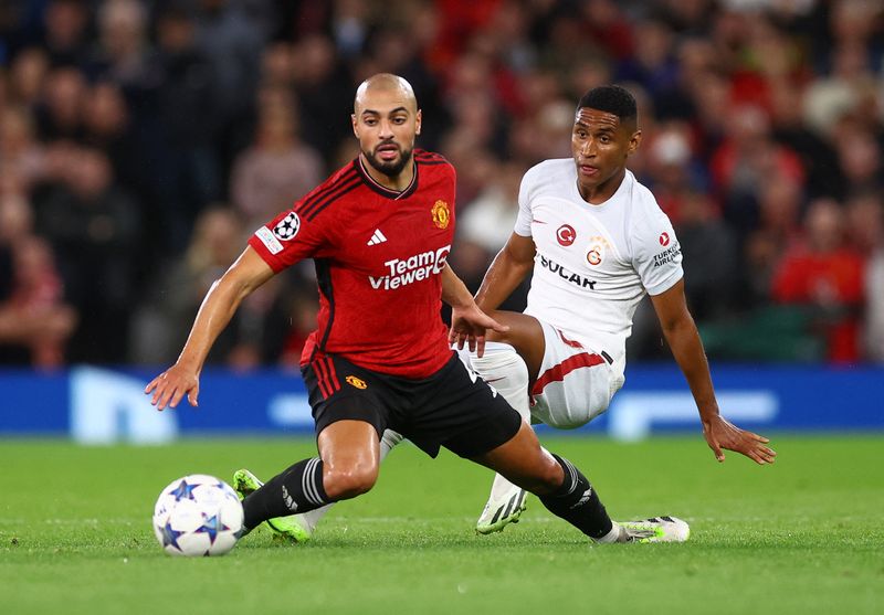 Soccer Football - Champions League - Group A - Manchester United v Galatasaray - Old Trafford, Manchester, Britain - October 3, 2023 Manchester United's Sofyan Amrabat in action with Galatasaray's Mateus Tete REUTERS/Carl Recine