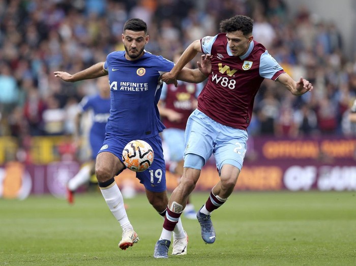 Chelsea's Armando Broja, left and Burnley's Ameen Al-Dakhil vie for the ball, during the English Premier League soccer match between Burnley and Chelsea, at Turf Moor, in Burnley, England, Saturday, Oct. 7, 2023. (Barrington Coombs/PA via AP)