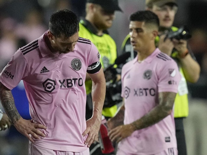 Inter Miami forward Lionel Messi (10) and forward Nicolás Stefanelli (22) react after losing 1-0 to FC Cincinnati in their MLS soccer match, Saturday, Oct. 7, 2023, in Fort Lauderdale, Fla. (AP Photo/Rebecca Blackwell)