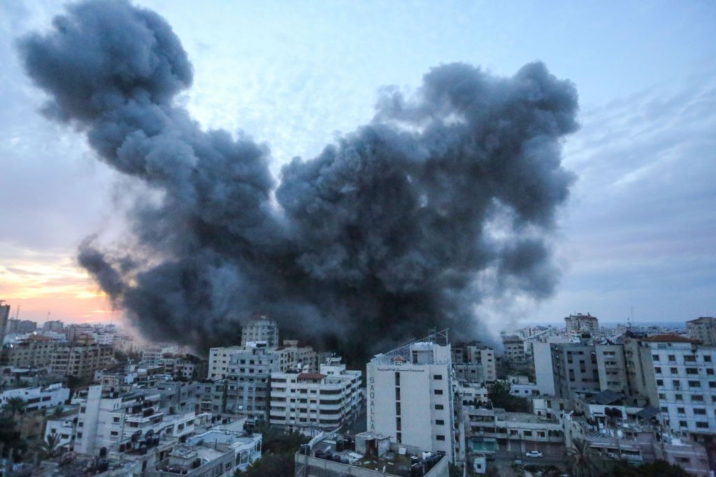 GAZA, PALESTINE - 2023/10/07: Smoke and flames rise after Israeli forces launched an airstrike on Gaza City. Palestinian militants have begun a 