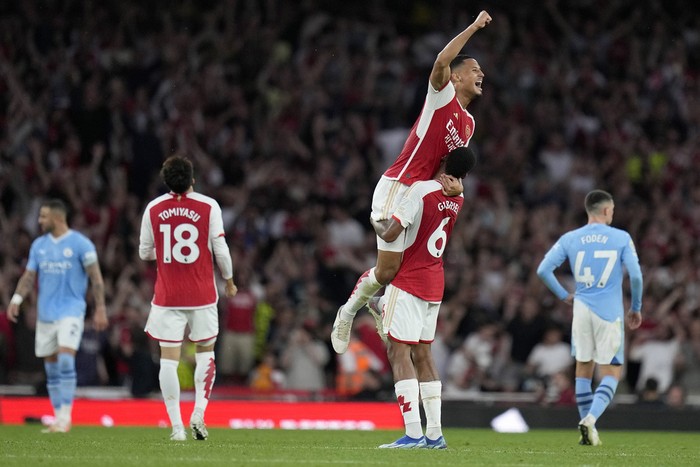 Arsenal Arsenal's William Saliba, top, and Arsenal's Gabriel celebrate winning the English Premier League soccer match between Arsenal and Manchester City at the Emirates Stadium in London, Sunday, Oct. 8, 2023.(AP Photo/Kirsty Wigglesworth)