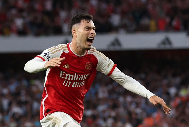 Soccer Football - Premier League - Arsenal v Manchester City - Emirates Stadium, London, Britain - October 8, 2023 Arsenal's Gabriel Martinelli celebrates scoring their first goal REUTERS/David Klein NO USE WITH UNAUTHORIZED AUDIO, VIDEO, DATA, FIXTURE LISTS, CLUB/LEAGUE LOGOS OR 'LIVE' SERVICES. ONLINE IN-MATCH USE LIMITED TO 45 IMAGES, NO VIDEO EMULATION. NO USE IN BETTING, GAMES OR SINGLE CLUB/LEAGUE/PLAYER PUBLICATIONS.