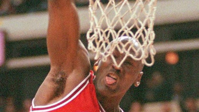 Michael Jordan Chicago Bull Michael Jordan dunks in two of his thirty-four points during his NBA game 22 February against the Atlanta Hawks in Atlanta, Ga. The Bulls beat the Hawks 96-91.AFP PHOTO Doug COLLIER (Photo by DOUG COLLIER / AFP)