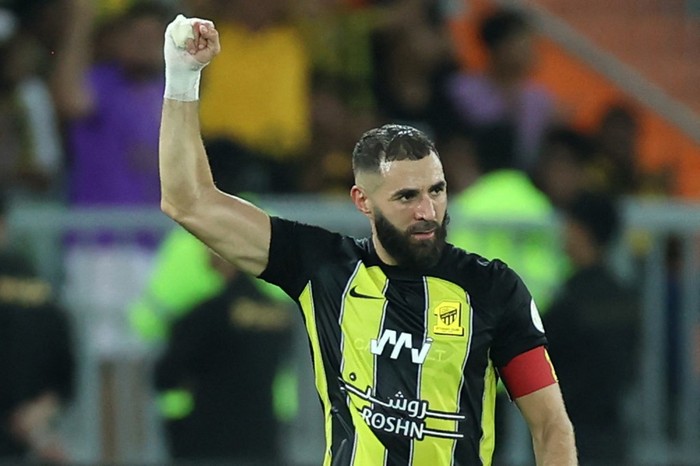 Ittihads French forward #09 Karim Benzema reacts after scoring a goal during the Saudi Pro League football match between Al-Ittihad and Al-Hilal at Prince Abdullah al-Faisal Stadium in Jeddah on September 1, 2023. (Photo by AFP) / The erroneous mention[s] appearing in the metadata of this photo by - has been modified in AFP systems in the following manner: [Al-Hilal] instead of [Al-Nassr]. Please immediately remove the erroneous mention[s] from all your online services and delete it (them) from your servers. If you have been authorized by AFP to distribute it (them) to third parties, please ensure that the same actions are carried out by them. Failure to promptly comply with these instructions will entail liability on your part for any continued or post notification usage. Therefore we thank you very much for all your attention and prompt action. We are sorry for the inconvenience this notification may cause and remain at your disposal for any further information you may require.