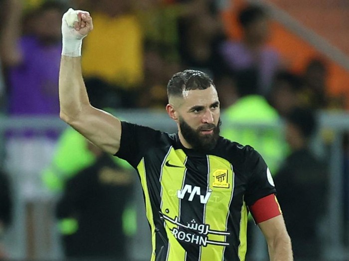Ittihad's French forward #09 Karim Benzema reacts after scoring a goal during the Saudi Pro League football match between Al-Ittihad and Al-Hilal at Prince Abdullah al-Faisal Stadium in Jeddah on September 1, 2023. (Photo by AFP) / The erroneous mention[s] appearing in the metadata of this photo by - has been modified in AFP systems in the following manner: [Al-Hilal] instead of [Al-Nassr]. Please immediately remove the erroneous mention[s] from all your online services and delete it (them) from your servers. If you have been authorized by AFP to distribute it (them) to third parties, please ensure that the same actions are carried out by them. Failure to promptly comply with these instructions will entail liability on your part for any continued or post notification usage. Therefore we thank you very much for all your attention and prompt action. We are sorry for the inconvenience this notification may cause and remain at your disposal for any further information you may require.