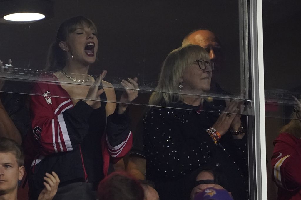 Taylor Swift and Donna Kelce cheer during the first half of an NFL football game between the Kansas City Chiefs and the Denver Broncos, Thursday, Oct. 12, 2023, in Kansas City, Mo. (AP Photo/Ed Zurga)