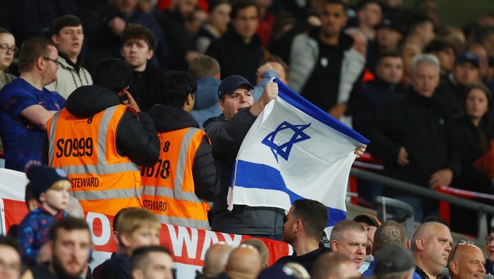 Soccer Football - International Friendly - England v Australia - Wembley Stadium, London, Britain - October 13, 2023 Fan with an Israel flag inside the stadium before the match Action Images via Reuters/Matthew Childs
