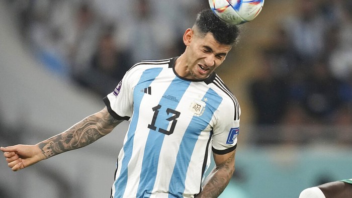 Argentinas Cristian Romero heads the ball during the World Cup round of 16 soccer match between Argentina and Australia at the Ahmad Bin Ali Stadium in Doha, Qatar, Saturday, Dec. 3, 2022. (AP Photo/Lee Jin-man)
