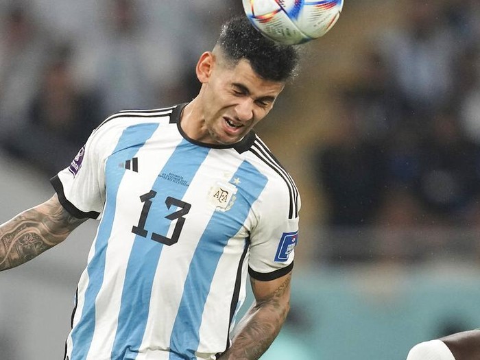 Argentinas Cristian Romero heads the ball during the World Cup round of 16 soccer match between Argentina and Australia at the Ahmad Bin Ali Stadium in Doha, Qatar, Saturday, Dec. 3, 2022. (AP Photo/Lee Jin-man)