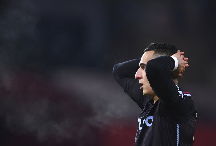 Aston Villa's Anwar El Ghazi reacts after teammate Aston Villa's Ollie Watkins nearly scores a gaol during the English Premier League soccer match between Manchester United and Aston Villa at Old Trafford in Manchester, England, Friday, Jan. 1, 2021. (Lawrence Griffiths/ Pool via AP)