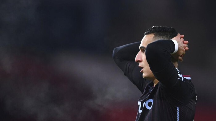 Aston Villas Anwar El Ghazi reacts after teammate Aston Villas Ollie Watkins nearly scores a gaol during the English Premier League soccer match between Manchester United and Aston Villa at Old Trafford in Manchester, England, Friday, Jan. 1, 2021. (Lawrence Griffiths/ Pool via AP)
