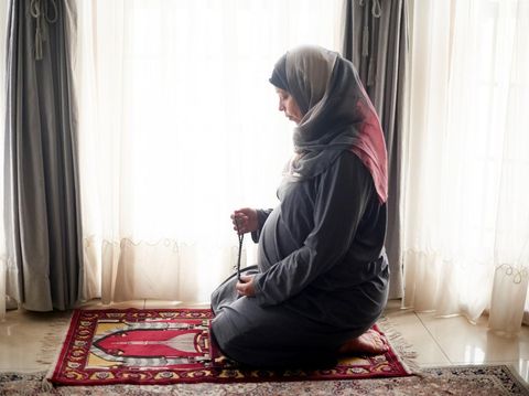 Pregnancy, muslim prayer beads and woman pray to Allah, god or holy spirit for Islam religion, faith and baby support. Hope, moslem home and profile of pregnant Islamic person praying for worship