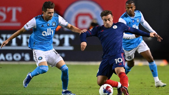 Oct 7, 2023; Chicago, Illinois, USA;  Chicago Fire FC midfielder Xherdan Shaqiri (10) controls the ball in the first half against Charlotte FC midfielder Brandt Bronico (13) at Soldier Field. Mandatory Credit: Jamie Sabau-USA TODAY Sports