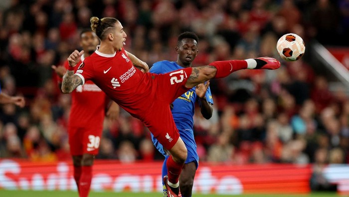 Soccer Football - Europa League - Group E - Liverpool v Union Saint-Gilloise - Anfield, Liverpool, Britain - October 5, 2023 Liverpools Kostas Tsimikas in action with Union Saint-Gilloises Lazare Amani REUTERS/Phil Noble